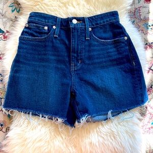 Madewell dark denim high-rise shorts with a raw hem
